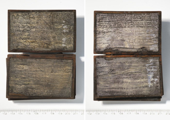 Pages of the small notebook. The Latin script carved into wax is clearly visible.